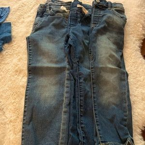 Three pairs of jeans.